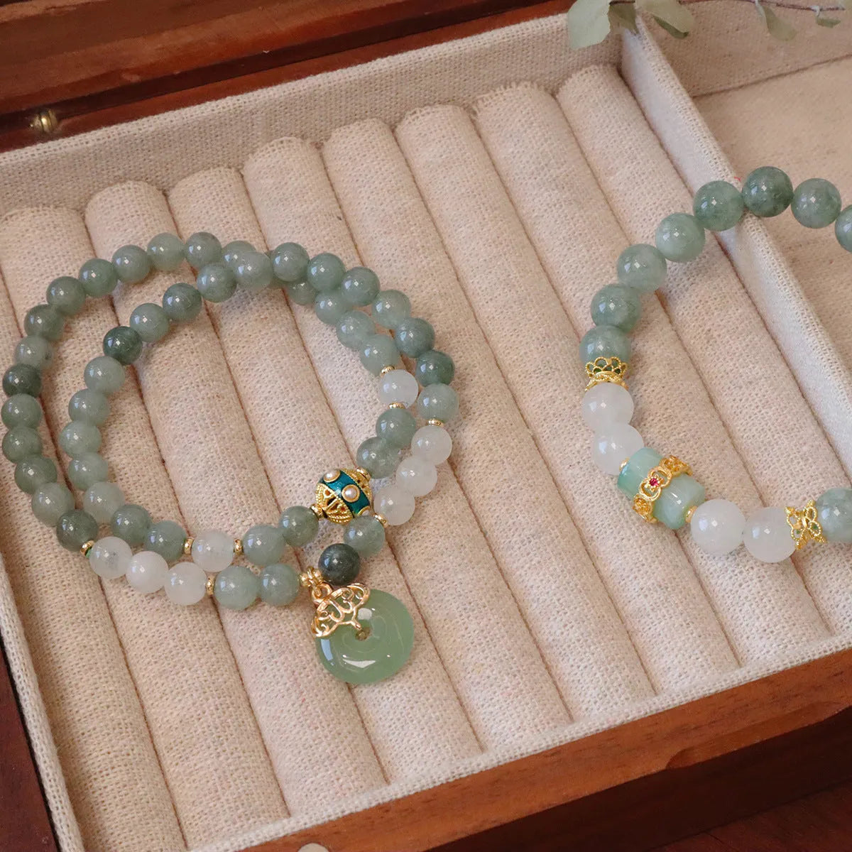 Women's Myanmar jade bracelet with Peace Buckle charm and crystal elements in geometric New Chinese style design