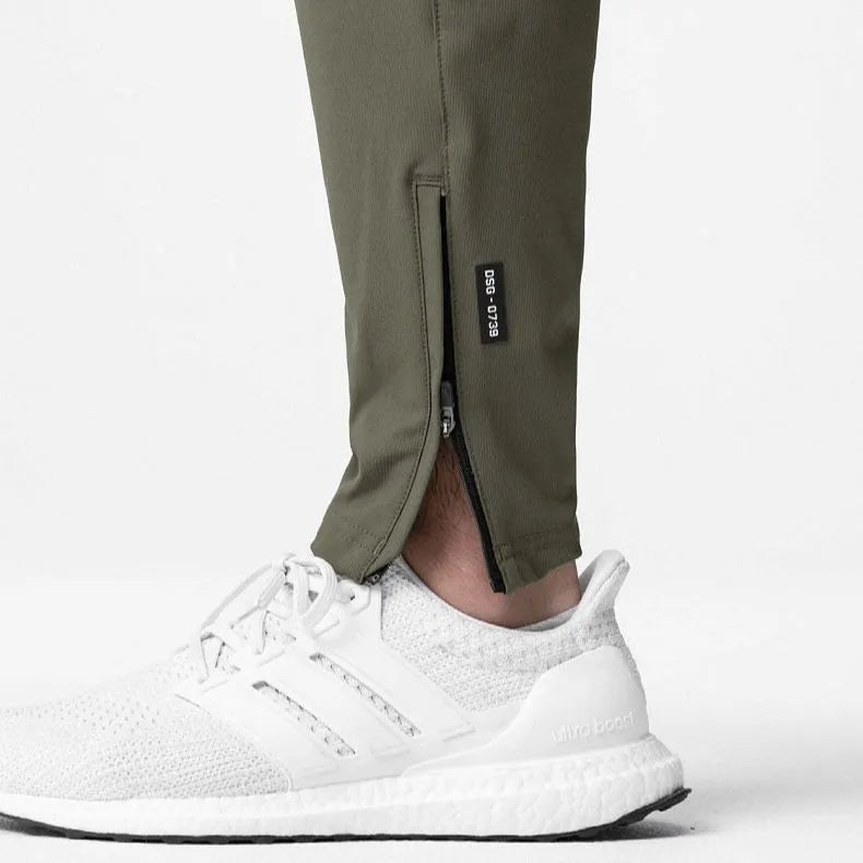 Men's grey quick-dry fitness trousers with ankle-tied design for gym workouts