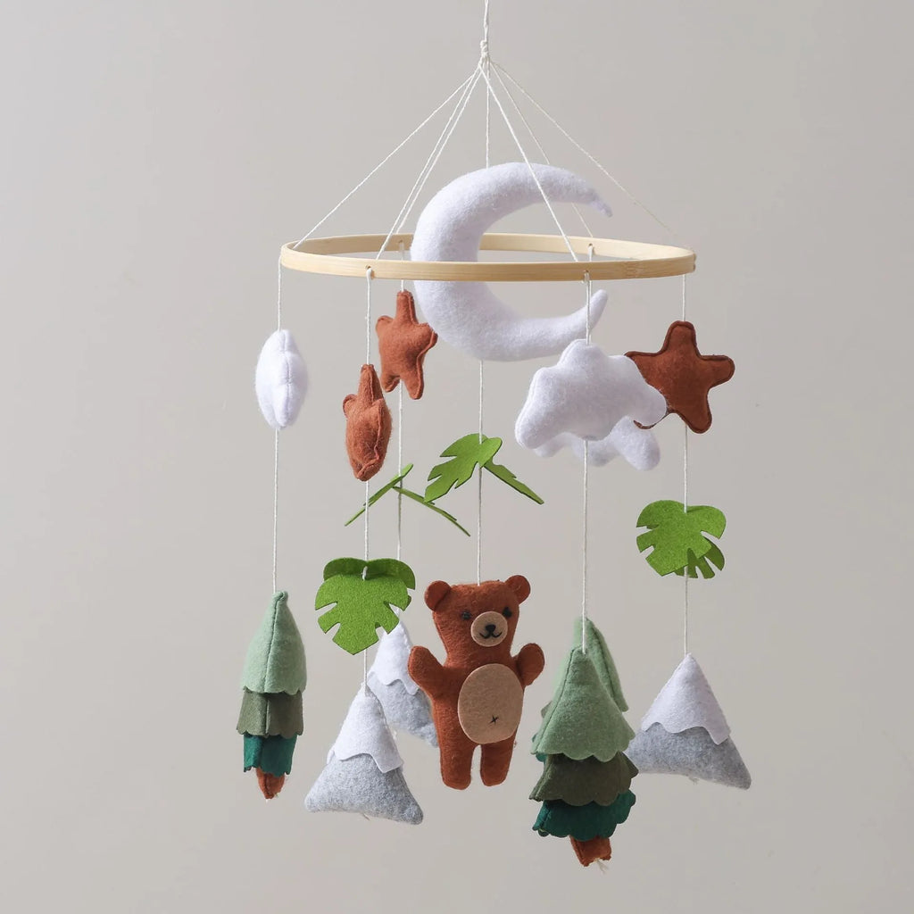 Handmade felt teddy bear bed bell in white on a wooden base for children's soothing sleep