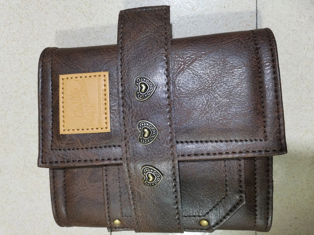 Brown A7 size notebook with a retro PU cover and leather buckle, showing loose-leaf binding.