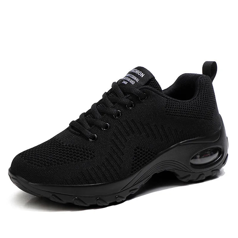 Women's black mesh sneakers with round toe and lace-up design, flat heel and low-top construction