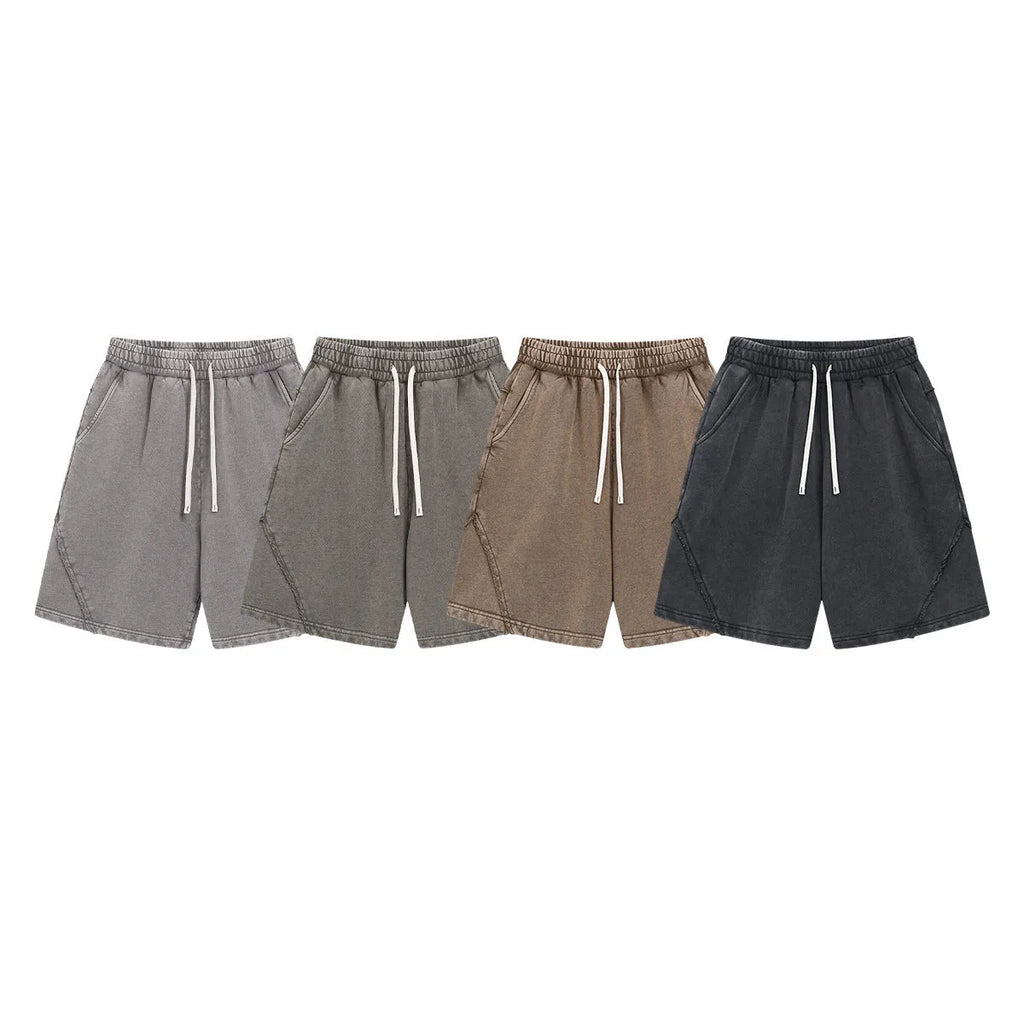 Man's loose-fit cotton terry shorts in a batik wash colour, showing street-style casual design.