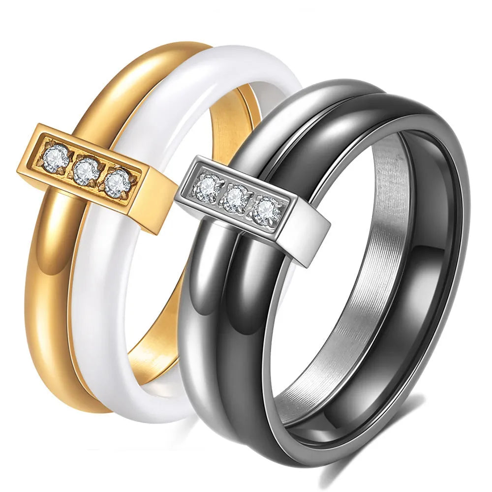 Ceramic geometric ring with glossy stitching and inlaid zirconium on 6MM band, shown in steel black and gold white finishes
