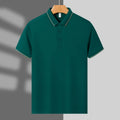 Men's light green loose-fit polo shirt with short sleeves and a single collar lapel, laid flat.