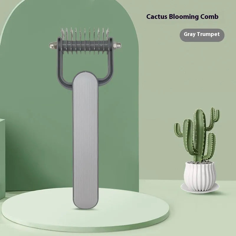 Green and grey dog detangling comb with stainless steel pins on a plastic handle, shown in small and large sizes.