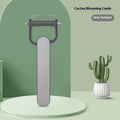 Green and grey dog detangling comb with stainless steel pins on a plastic handle, shown in small and large sizes.