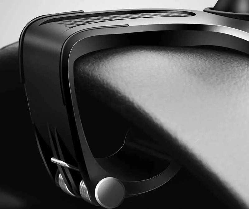 Black multifunctional car phone holder clipped onto a car sun visor, holding a smartphone.