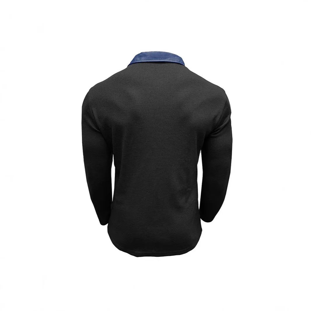 Man wearing a long-sleeved waffle-texture polo shirt in a solid colour, showcasing the retro style and asymmetric detail.