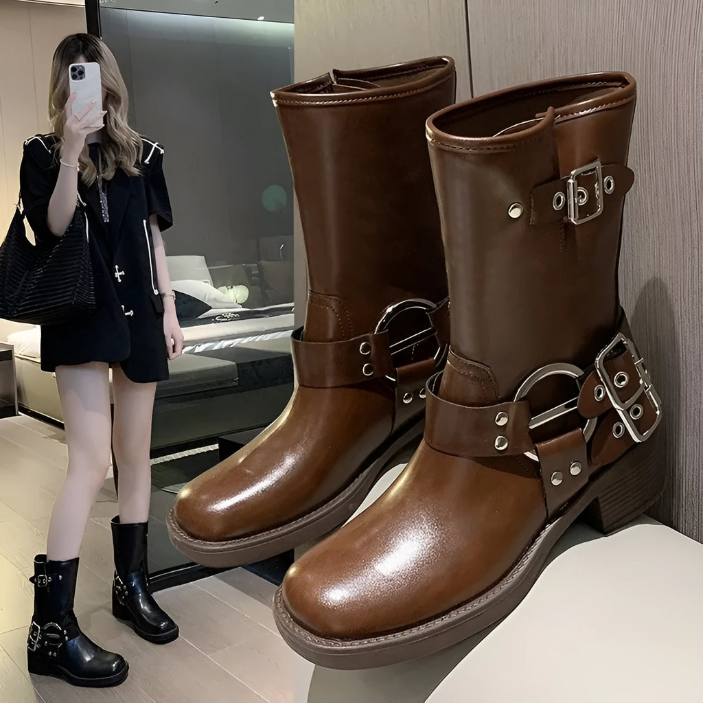 Women's black platform boots with buckle strap at middle calf length