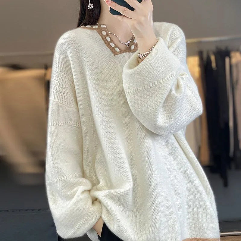 Women's camel coloured V-neck long sleeve viscose sweater on a hanger.