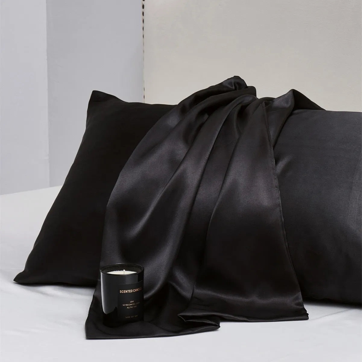 Solid colour satin pillowcase pair showing plain weave texture and available in multiple colour options