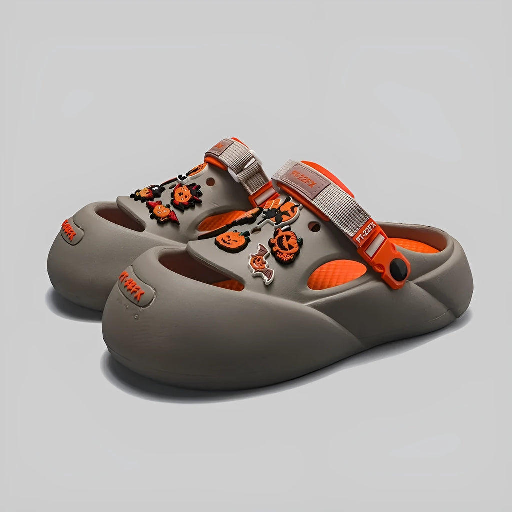 Men's grey beach shoes with open-hole design and covered toe protection on sandy surface