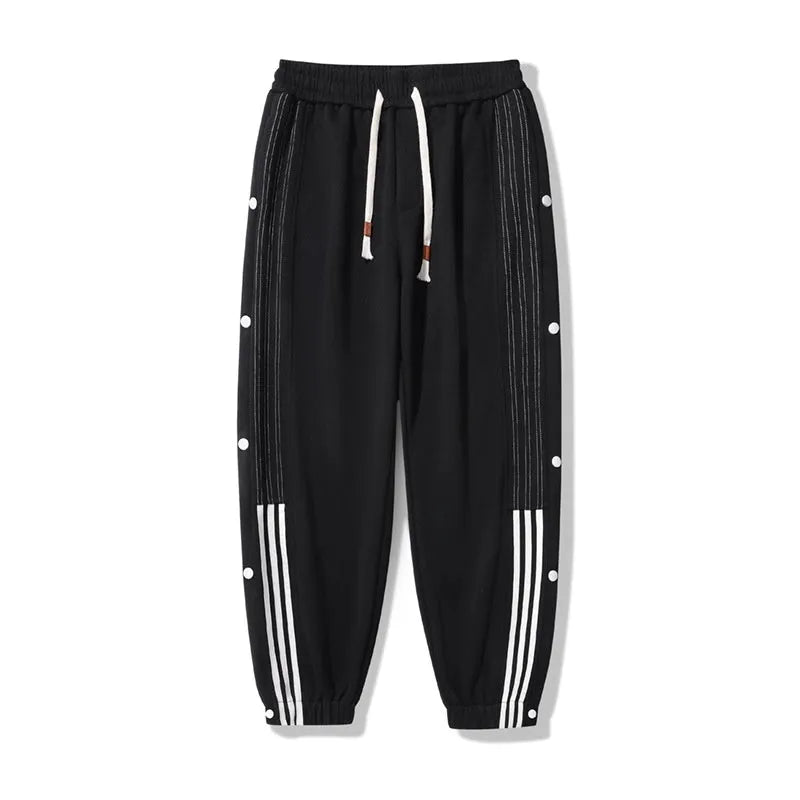 Men's black sports sweatpants with high waist, drawstring closure and ankle ties in cotton blend fabric