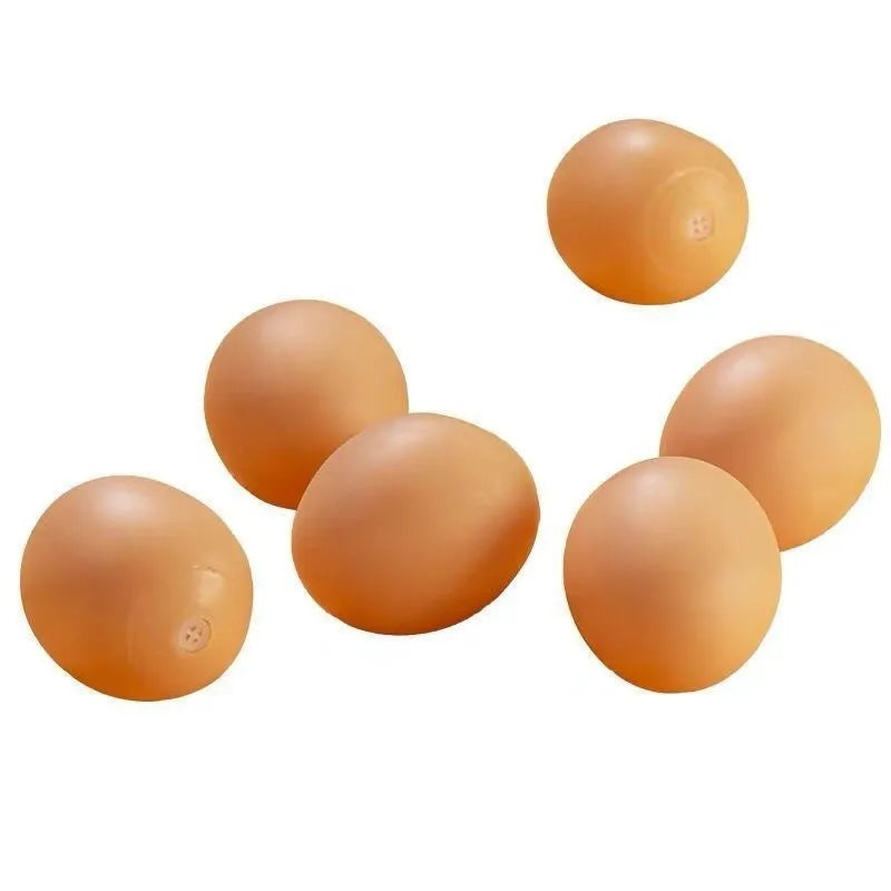 Natural rubber egg-shaped dog chew toy with a squeaker inside for dental play.