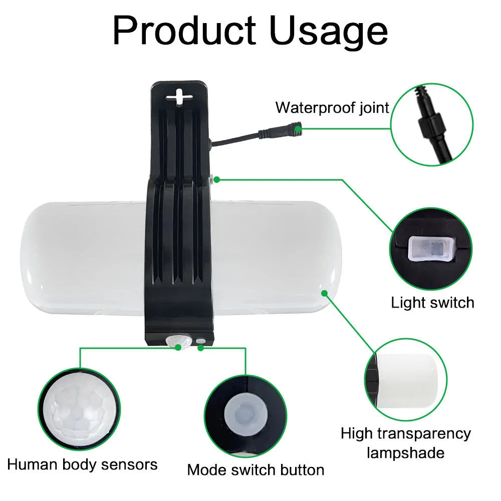 Black outdoor solar floodlight with motion sensor and abstract design on wall mounting bracket