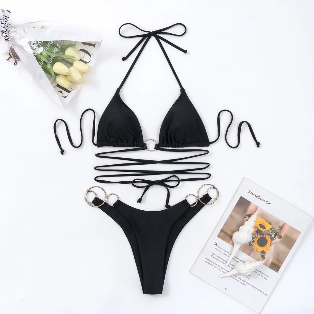 Black women's bikini swimsuit set with metal ring straps and backless design
