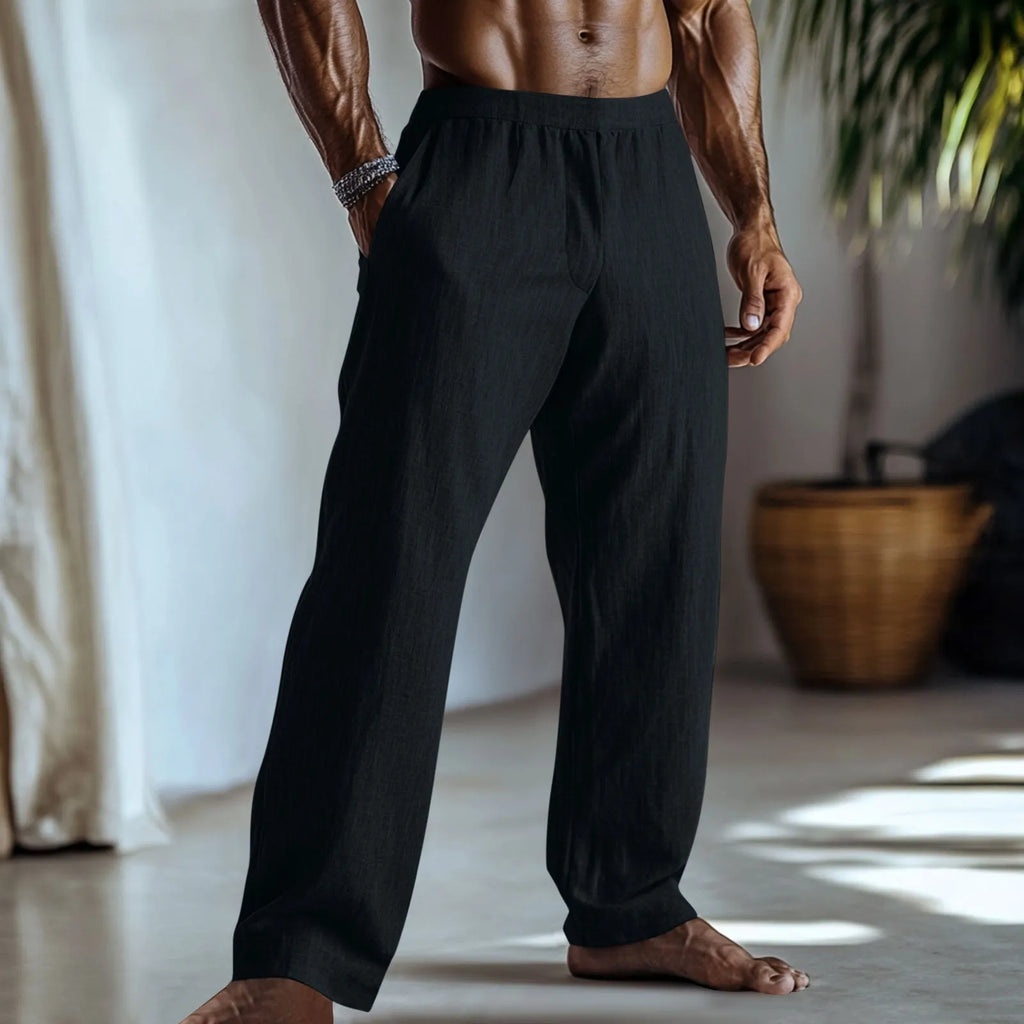 Man wearing straight-leg cotton linen casual trousers in a solid colour with pockets.