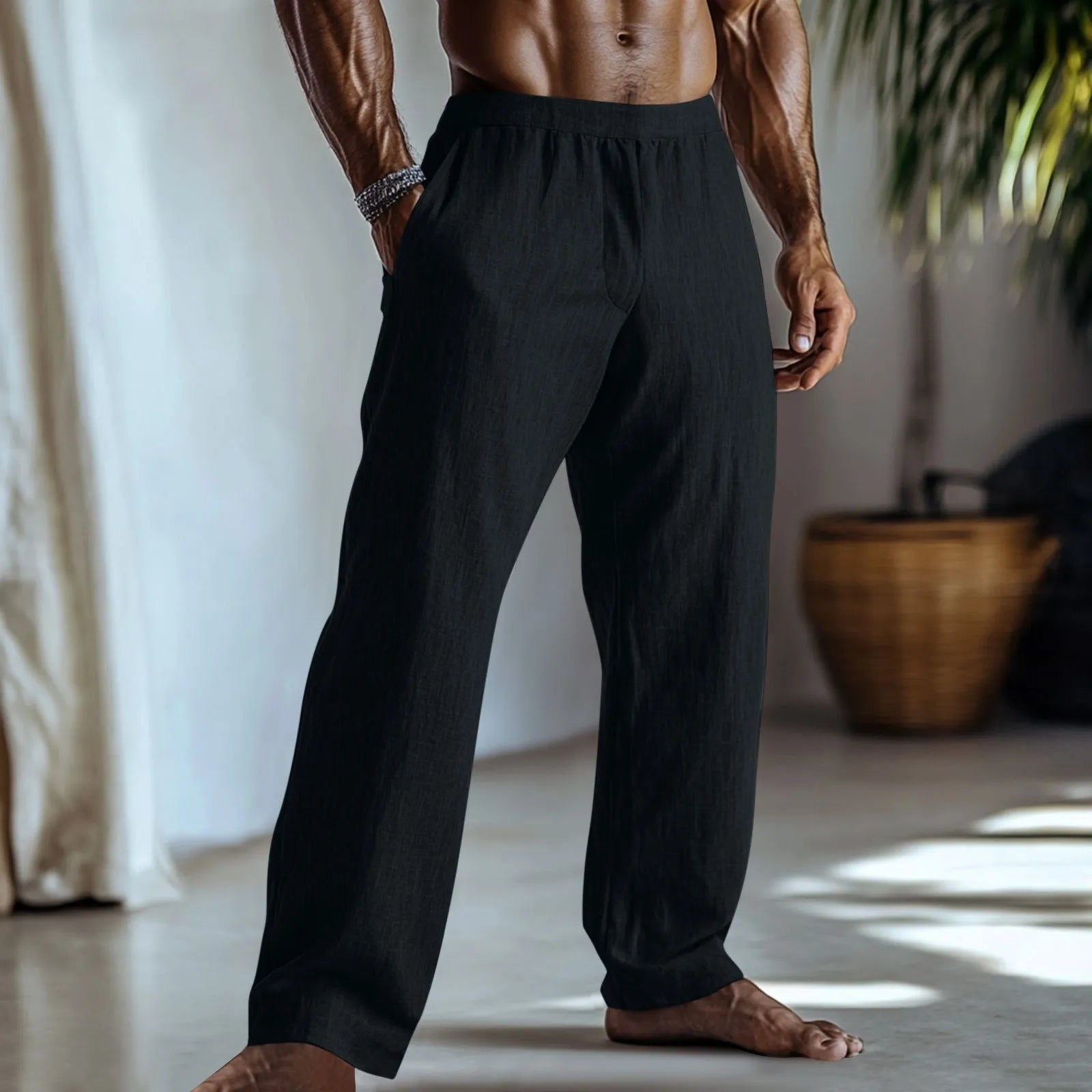 Man wearing straight-leg cotton linen casual trousers in a solid colour with pockets.