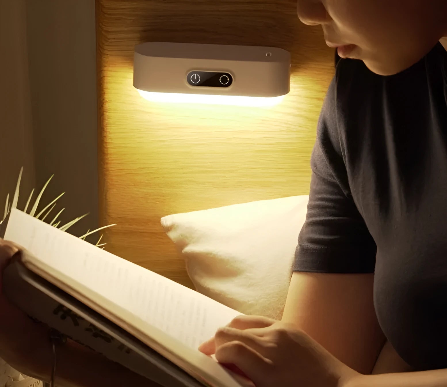 White magnetic USB rechargeable LED night light with touch controls and a curved light surface.