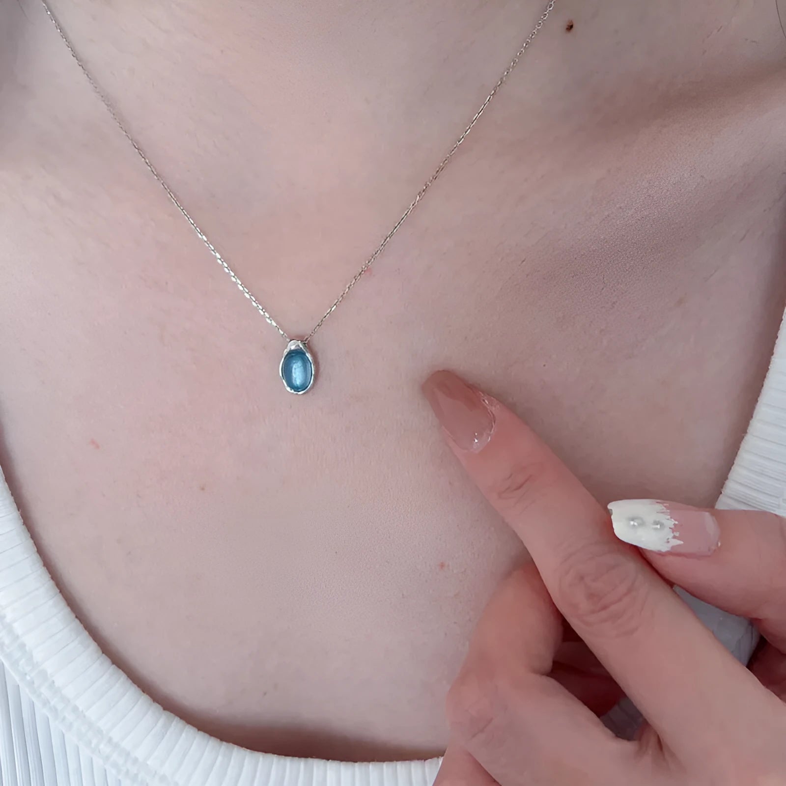 Navy blue water drop necklace with geometric pendant on copper cross chain, platinum-colour electroplating