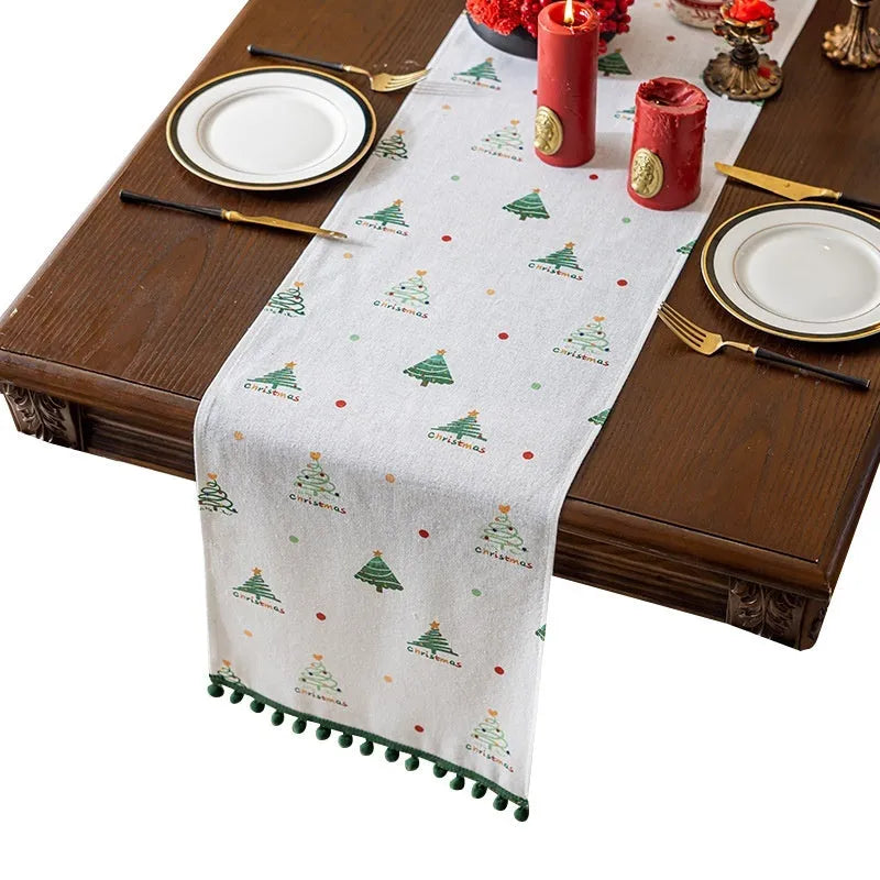 Green Christmas table runner with tree pattern on a dining table, 35cm wide polyester imitation linen