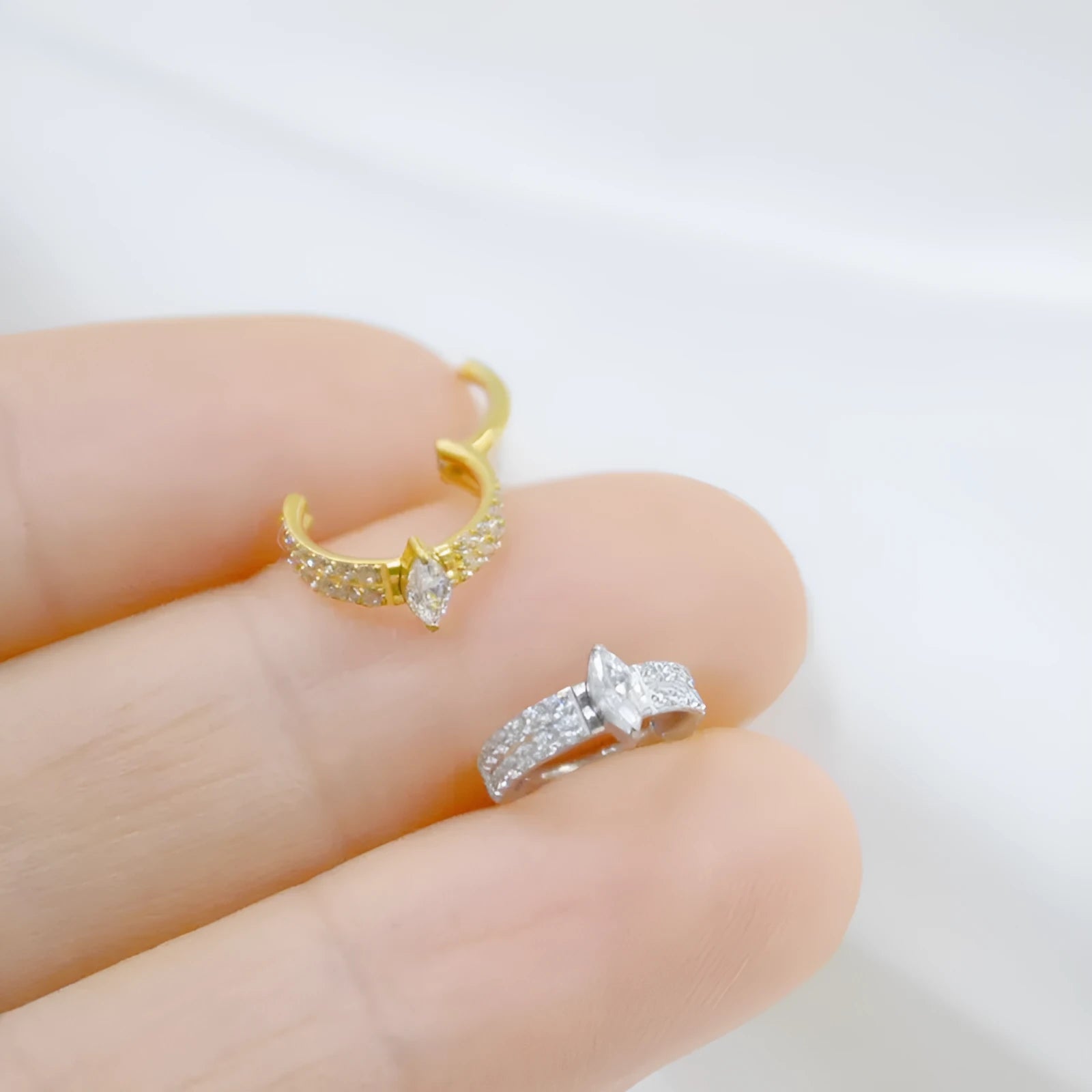 Gold and silver titanium steel heart-shaped earrings with zircon stones measuring 1.2x8mm