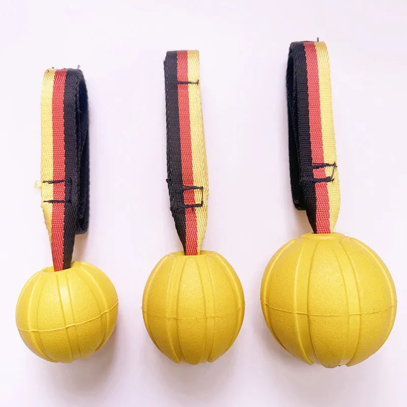 Yellow and camouflage coloured EVA floating knot balls for dogs in three different sizes on a blue background.