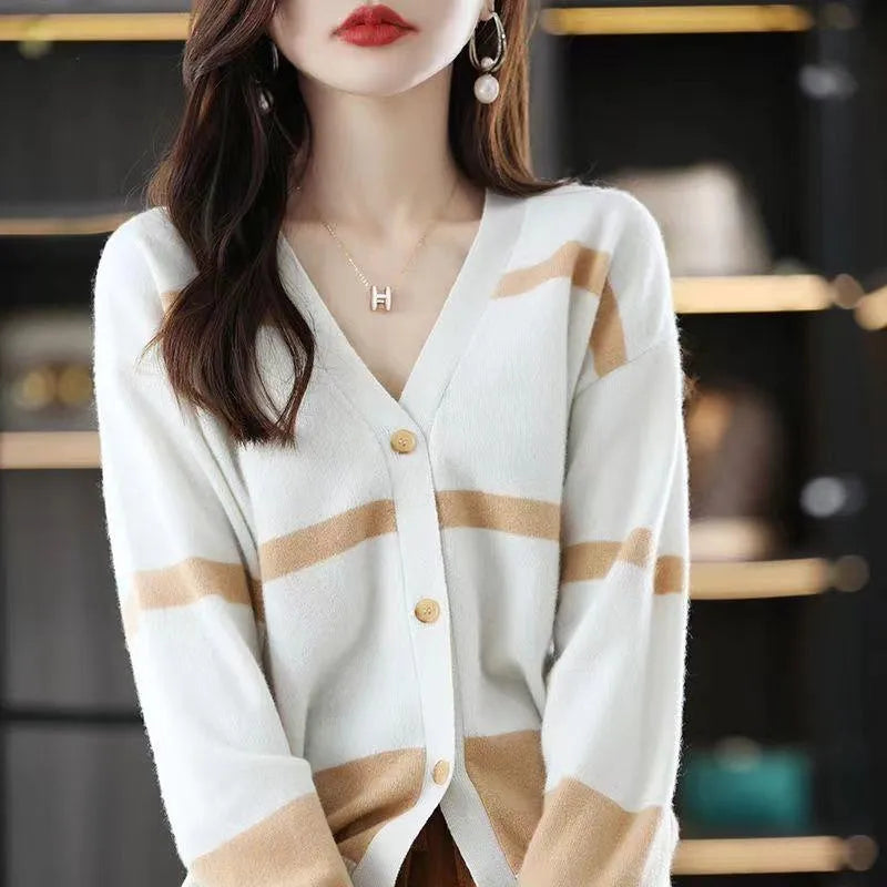 Women's black and white striped knitted cardigan with 3D pattern and V-neck.