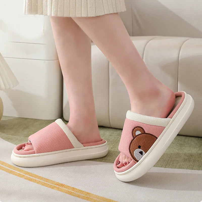 Cartoon bear cotton linen indoor slippers with PVC non-slip sole, shown in orange, pink, silver grey, and light brown