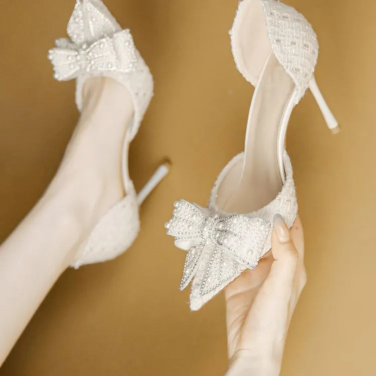 Women's pointed toe pumps with rhinestone bow, side cut-out and skirt detail, PU upper, beige