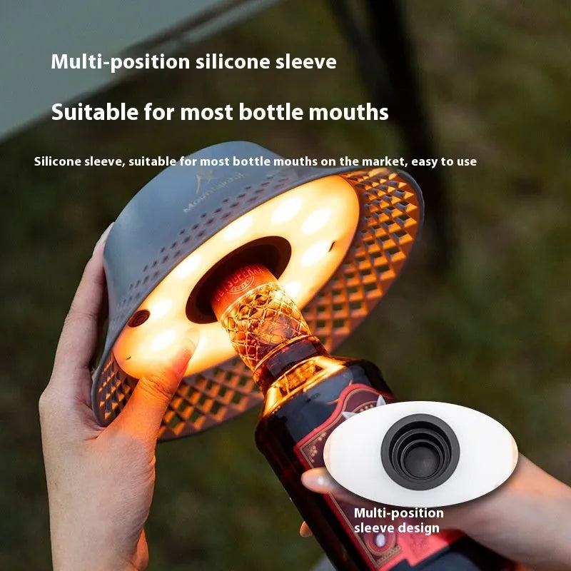 Beige wine bottle-shaped camping lantern with USB-C charging port and LED lights