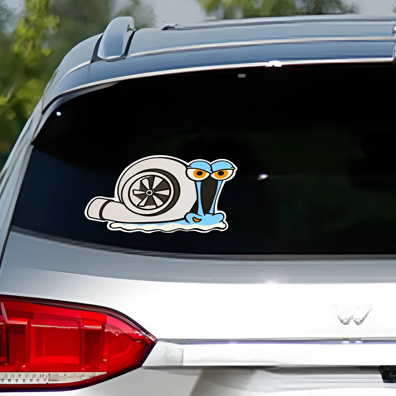 Reflective car bumper sticker with colourful cartoon snail design measuring 12cm by 8cm