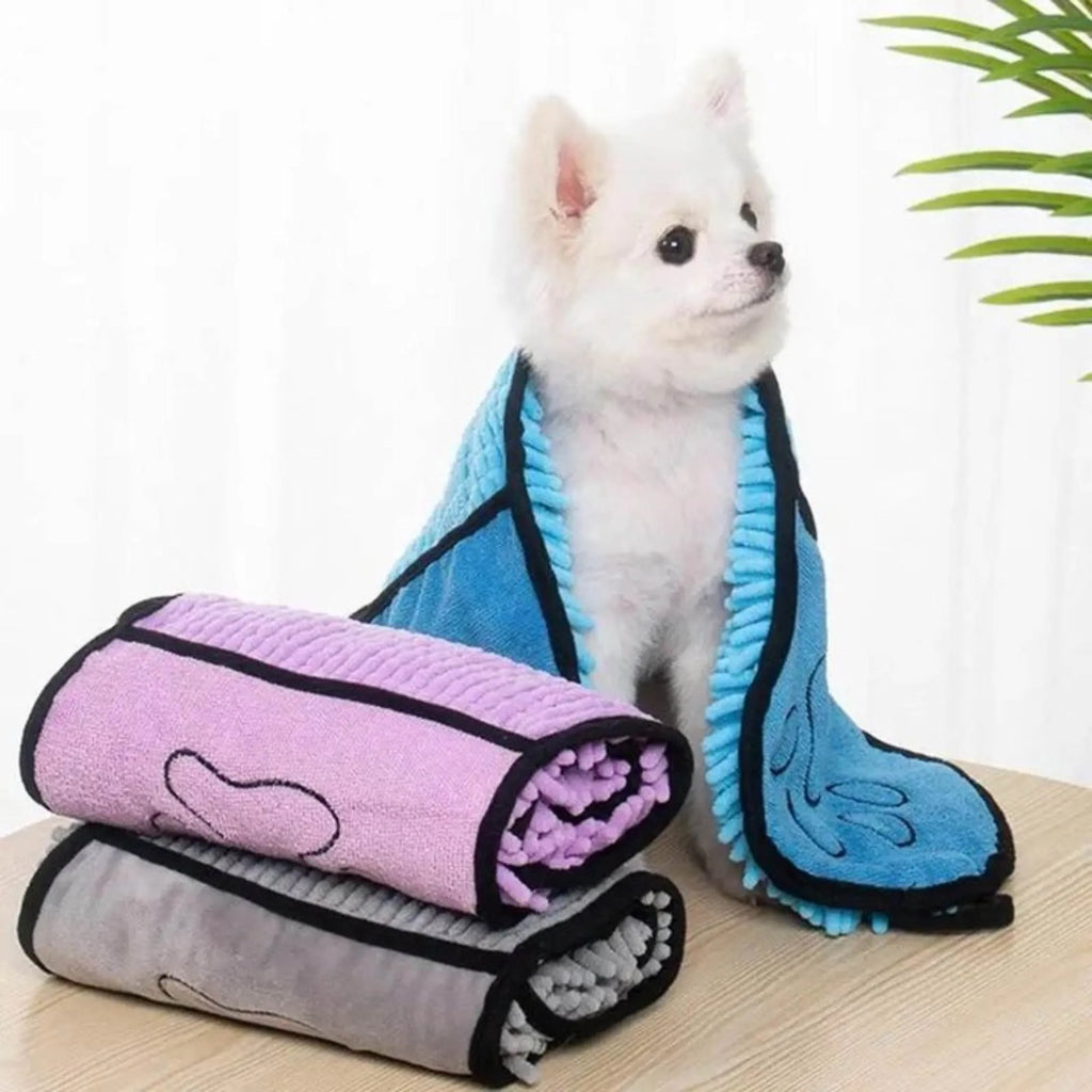 Blue quick-dry pet bath towel shown draped, sized 62 cm by 23 cm for drying dogs and cats.