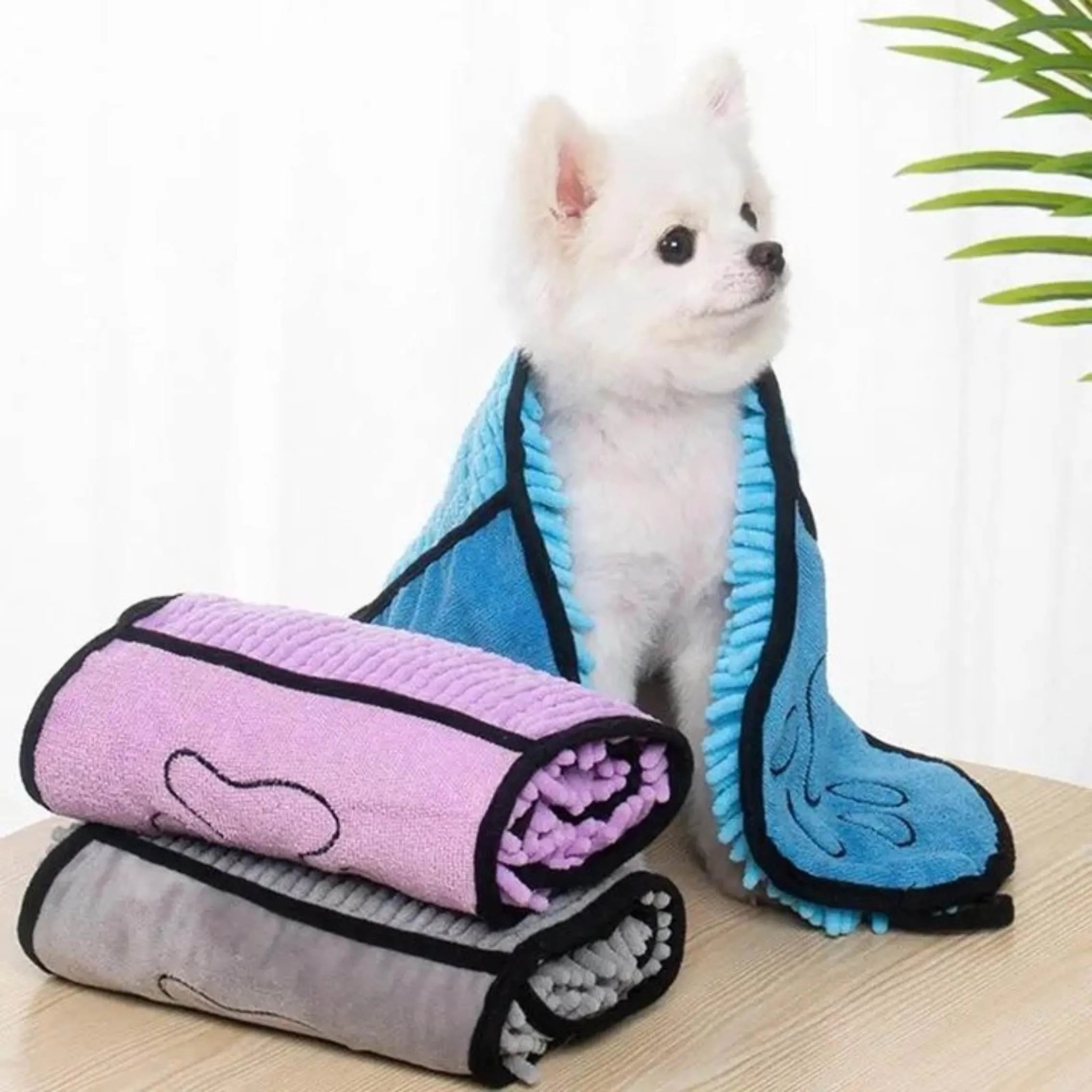 Blue quick-dry pet bath towel shown draped, sized 62 cm by 23 cm for drying dogs and cats.