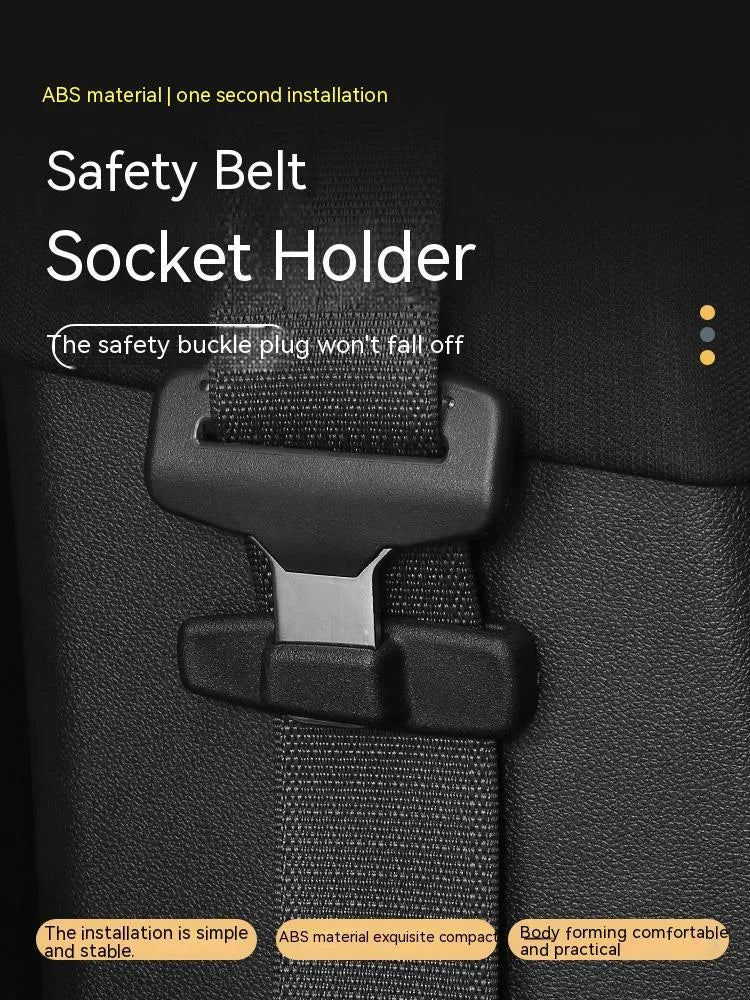 Two black ABS plastic universal seatbelt stopper clips shown next to a car seatbelt.