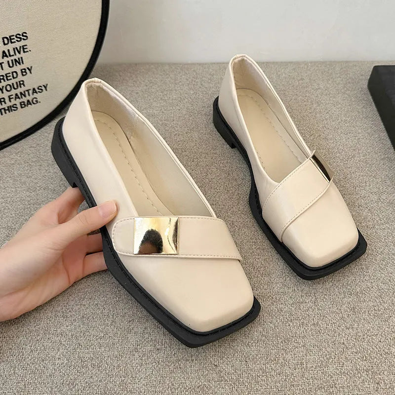 Women's beige artificial leather square toe flat-heeled slip-on ankle boots with a metal buckle.