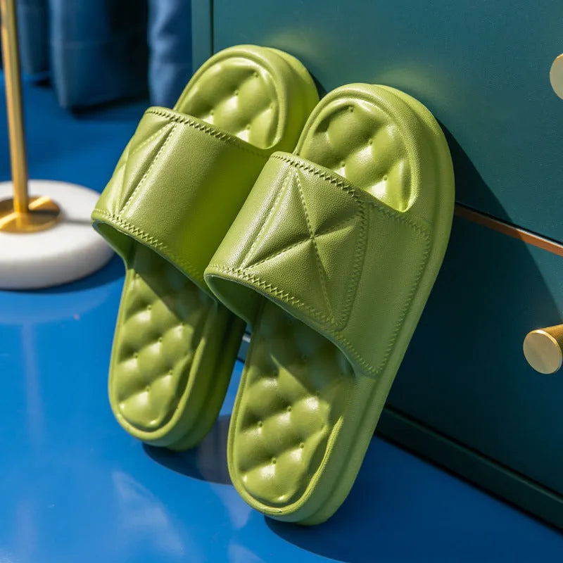 Pair of soft EVA bathroom slippers with a thick non-slip sole, shown in a selection of colours.