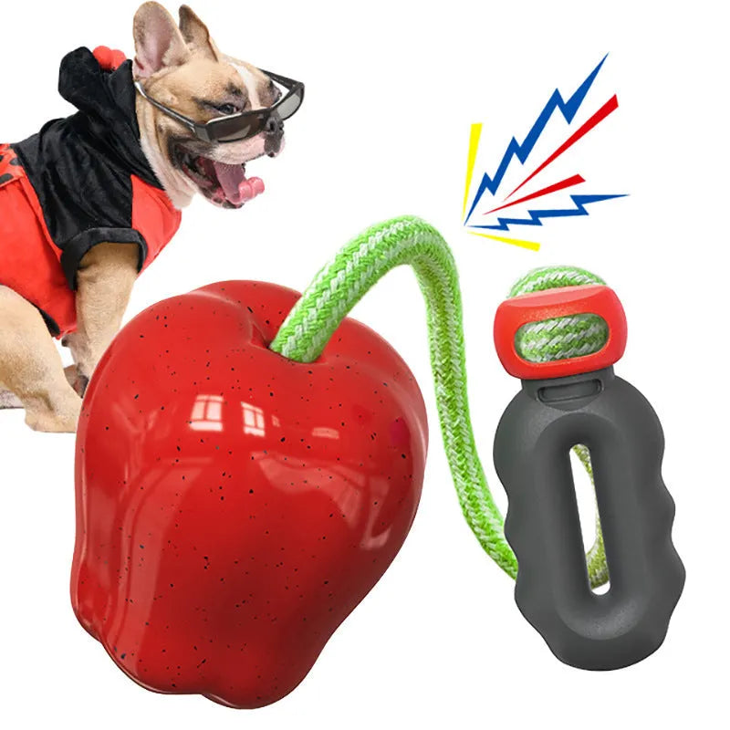 Green plastic apple-shaped dog toy with food dispensing openings for interactive feeding games