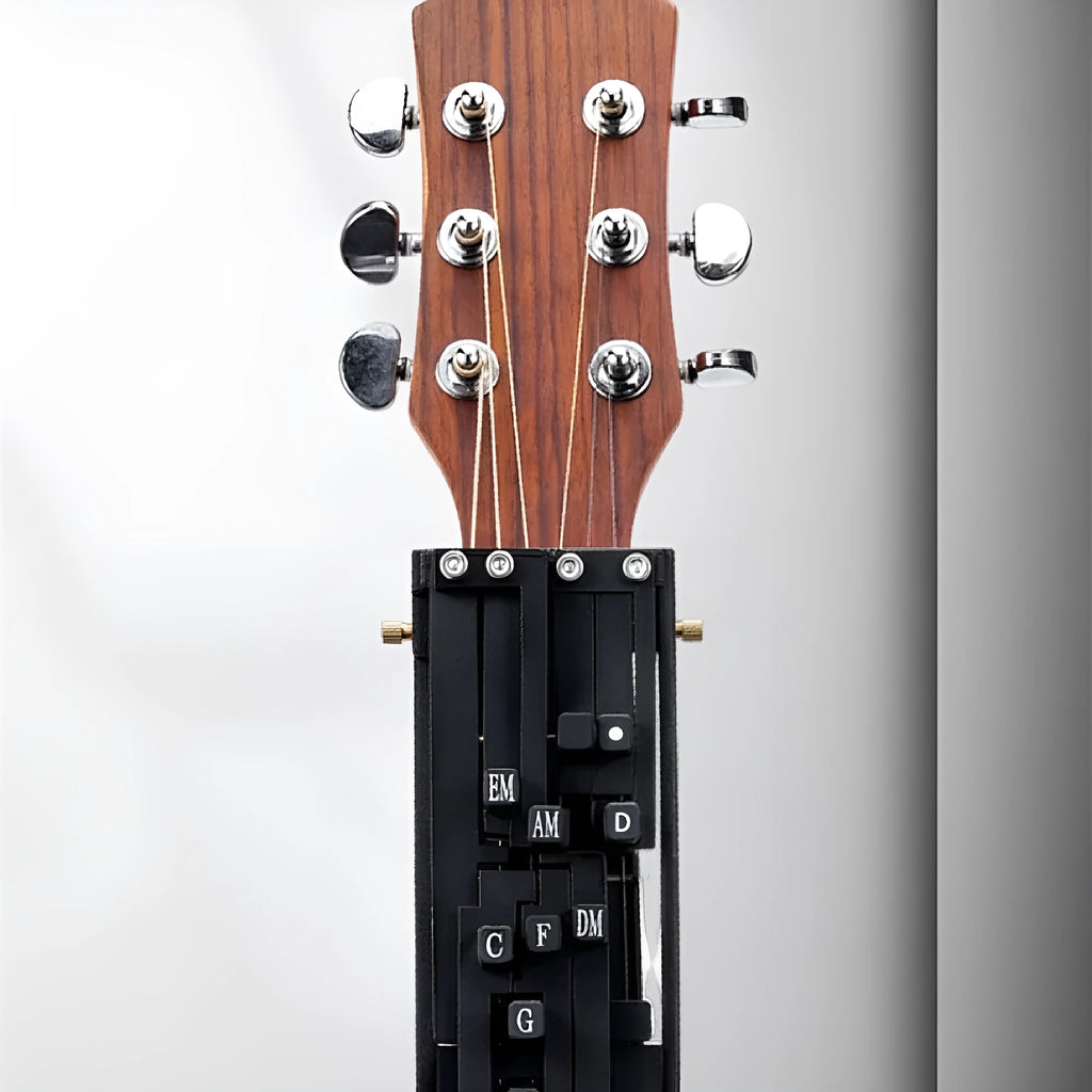 Black automatic guitar chord changing device for folk music beginners on a guitar neck.