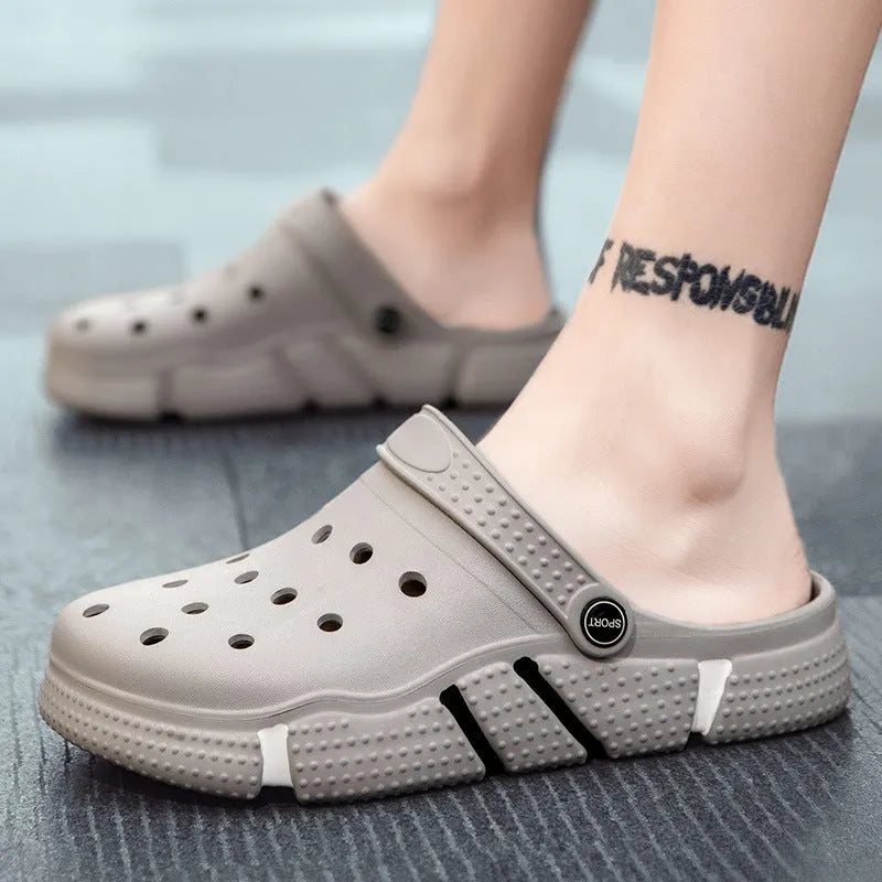 Men's non-slip EVA closed toe sandals in black with hollow-out design and height increasing sole.