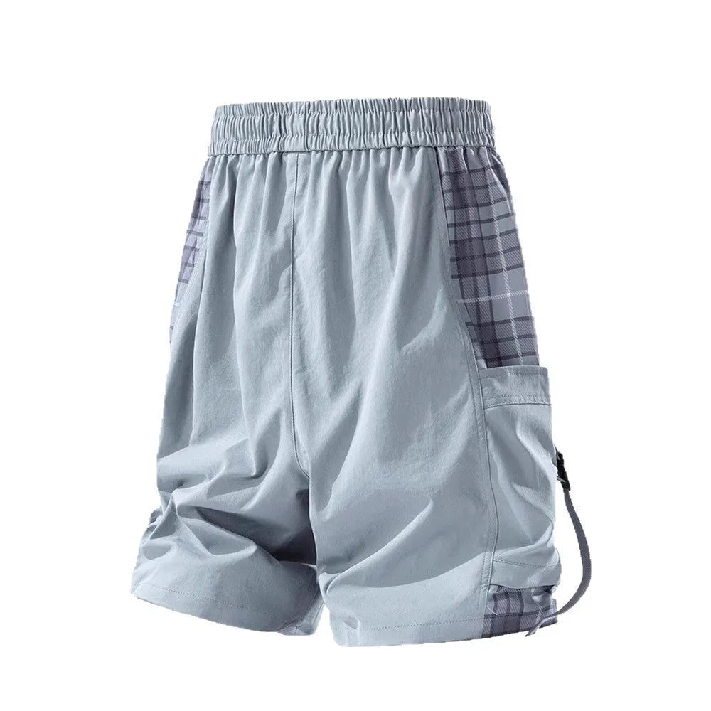 Man's loose-fit cargo shorts in grey with plaid stitching detail on the legs.