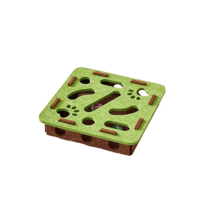 Green brown felt cube cat scratching toy with a square hole in the centre panel.