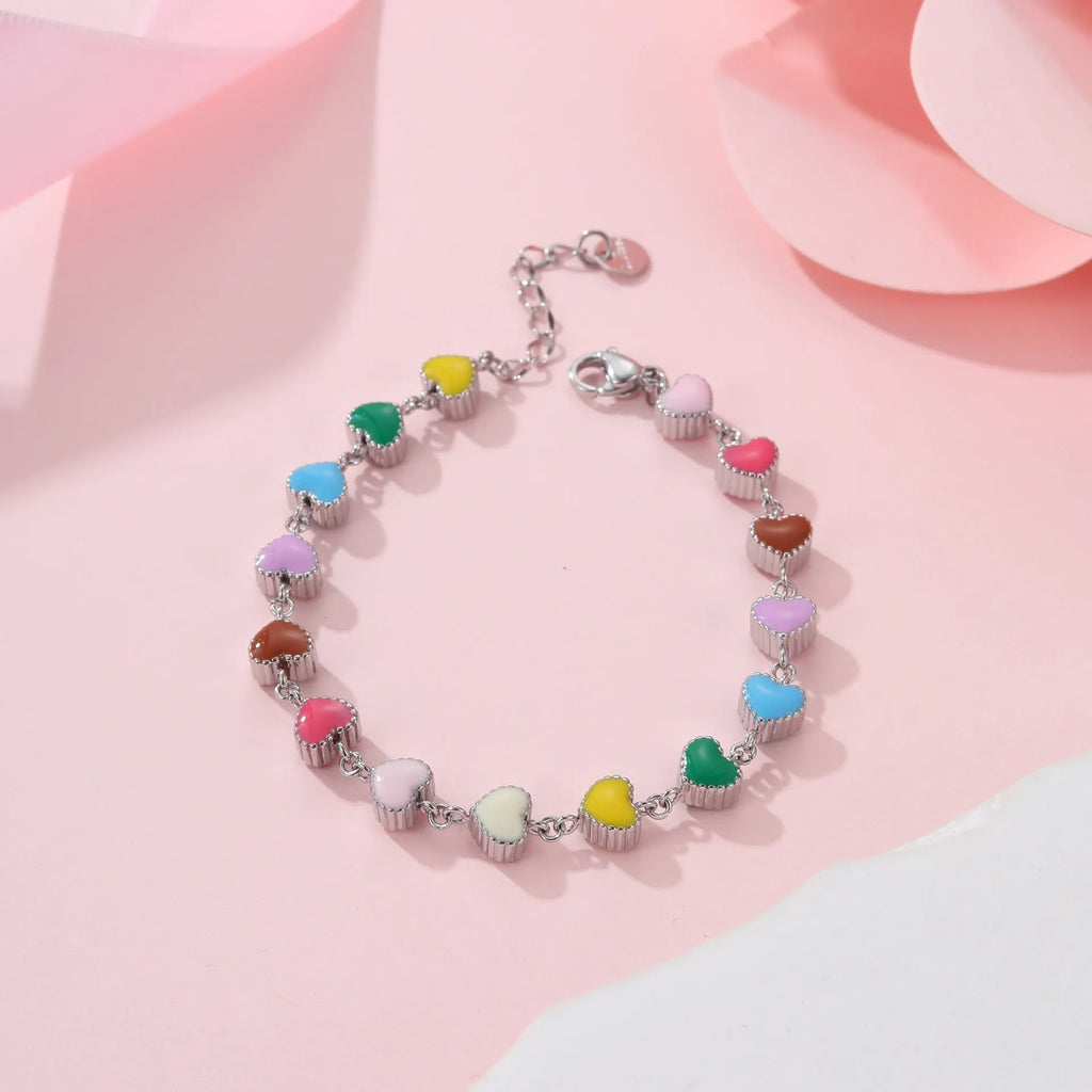 Women's titanium steel bracelet with heart-shaped charm in gold or steel electroplated finish
