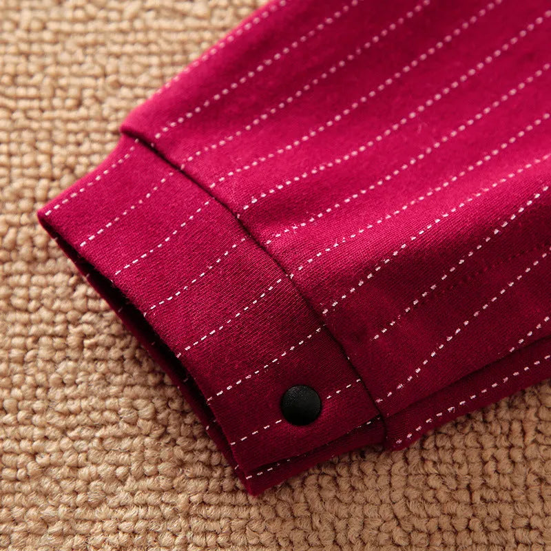 Wine red cotton baby boy romper one-piece suit with long sleeves and single-breasted closure.