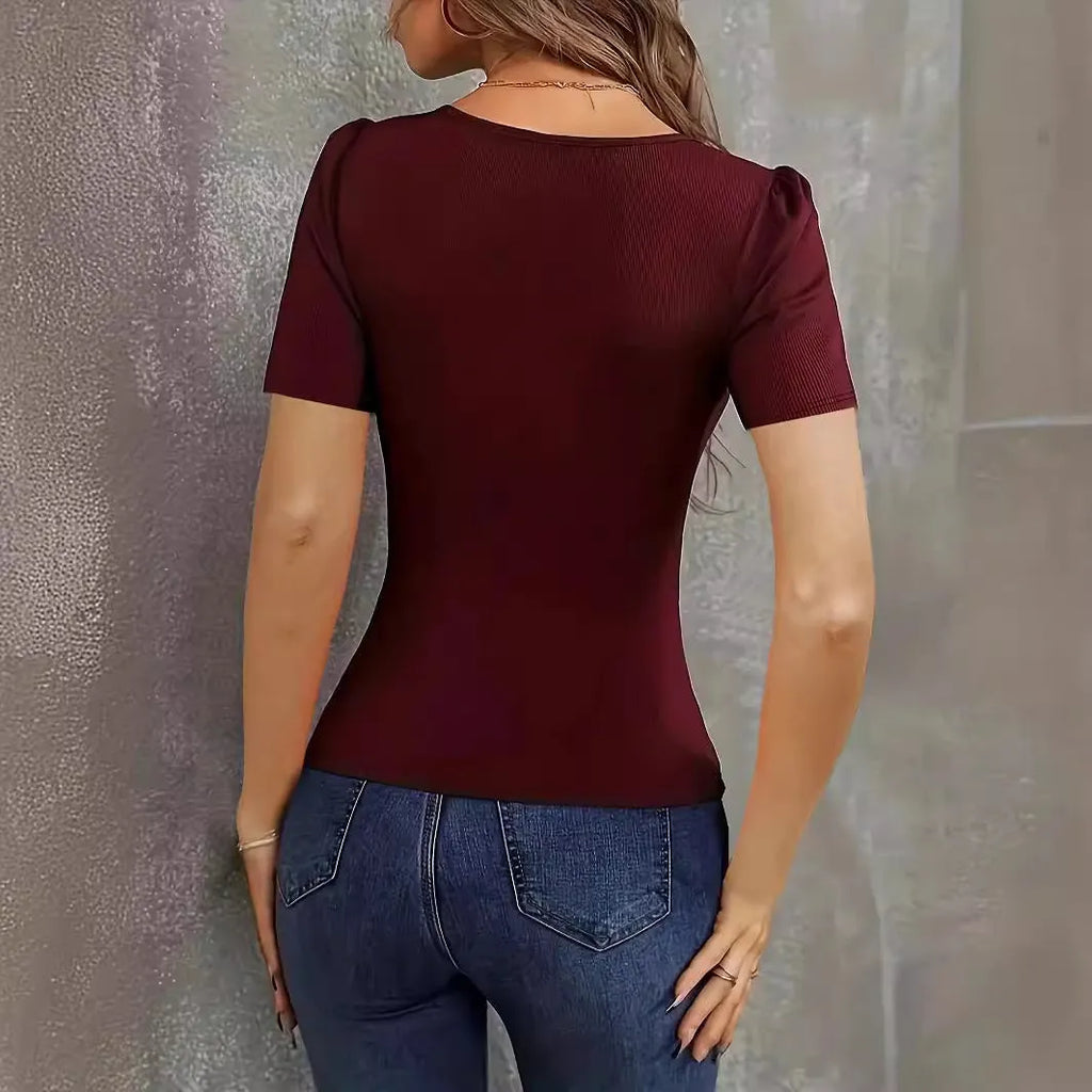 Women's wine red knitted short sleeve pullover with low neckline and slim fit on a hanger