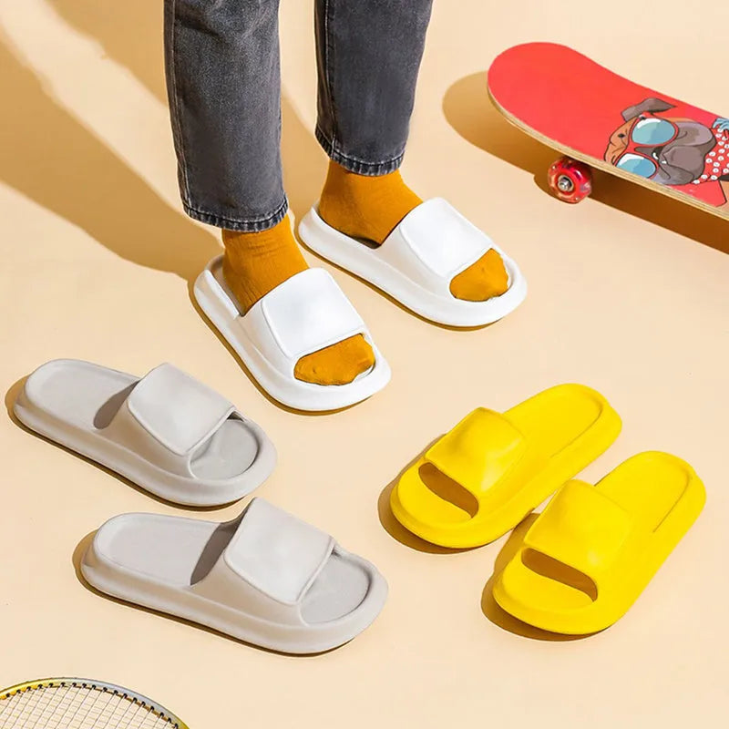 Unisex EVA flip-flop slippers with thick sole, shown in various colours on a bathroom tile floor.