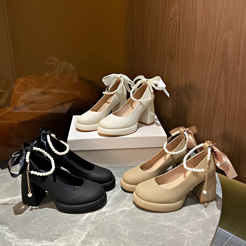Beige women's Mary Jane shoes with a chunky heel, round toe, and an ankle-strap buckle.