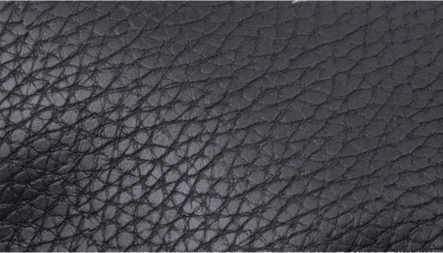 Breathable car headrest with leather cover, down yarn filling, and classic punched ventilation pattern