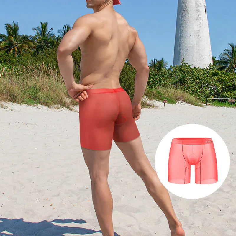 Men's ice silk nylon boxer shorts in orange, pink, or red solid colours showing low waist design