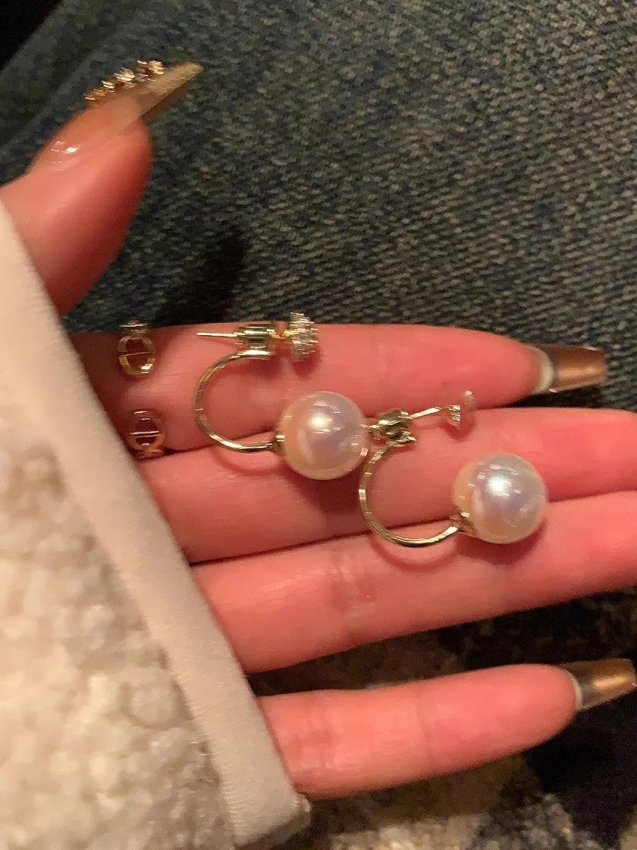 Geometric pearl stud earrings in gold electroplated copper with hanging-back design for women